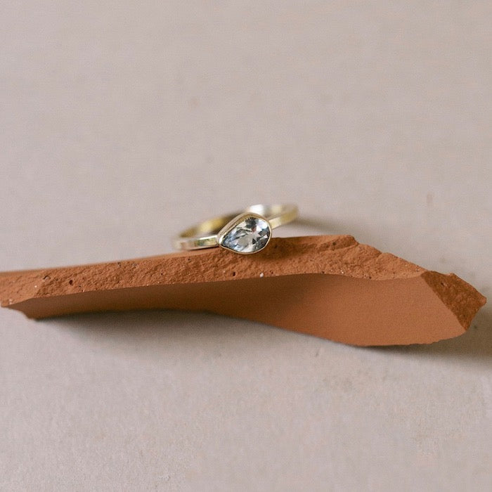 White Topaz Pear Solitaire Ring